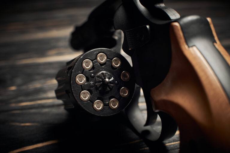 revolver cylinder with Flobert ammo 4mm on dark wooden background